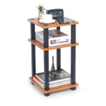 3 tier end table in brown wood with open storage shelves holding books and decor items