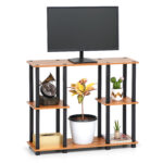 6 tier TV stand in brown wood with multi-level display shelves holding TV and living room decor