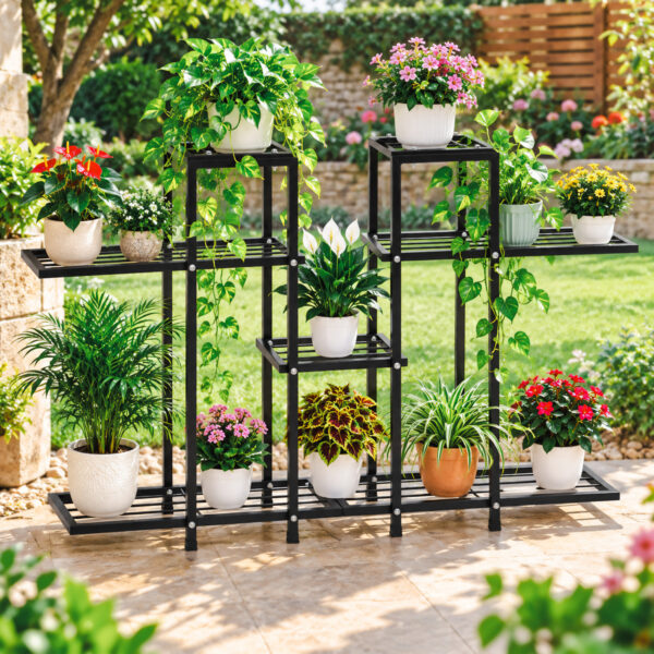 multi tier plant stand in black metal holding multiple potted flowers on garden